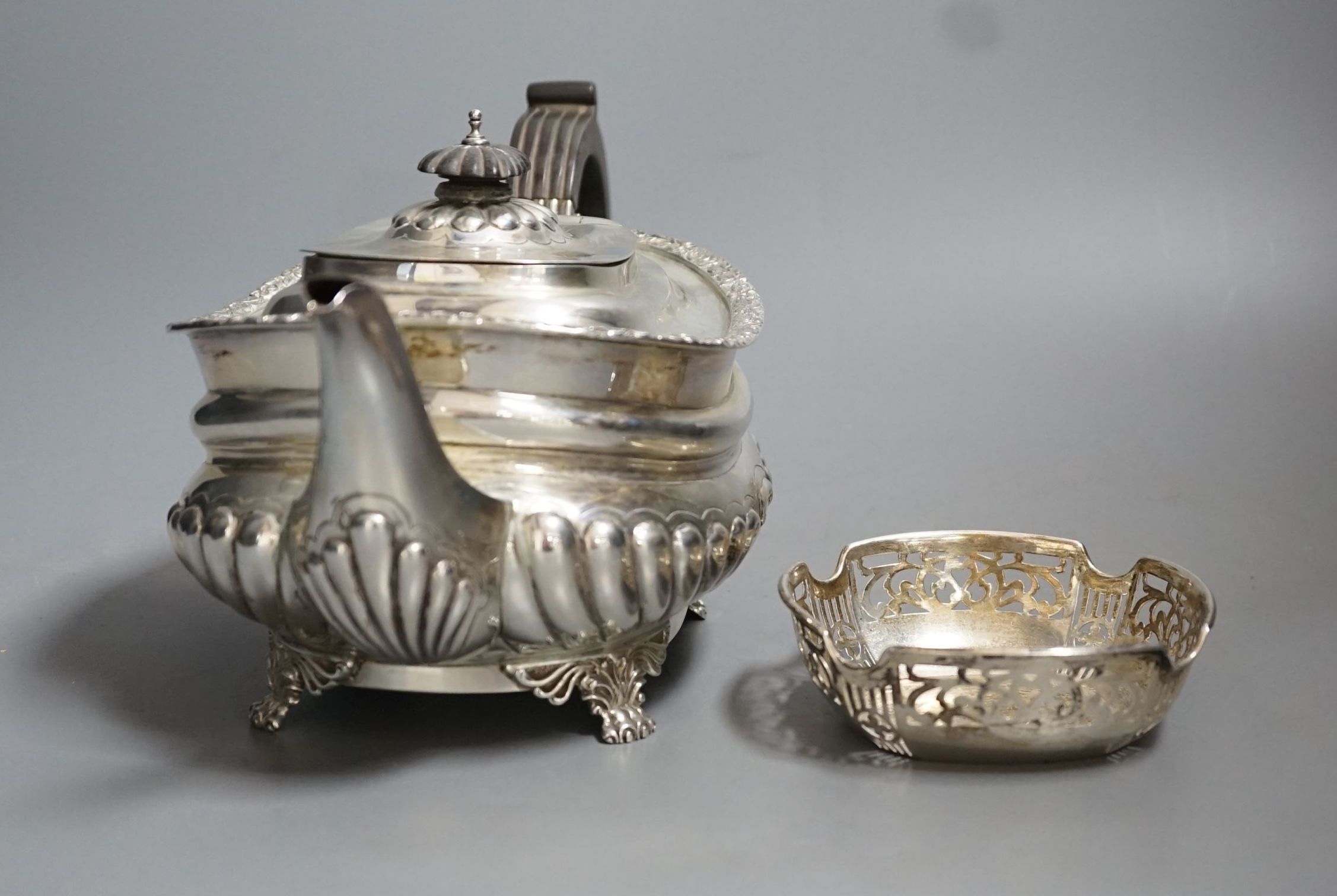 A George V demi-fluted silver teapot, by Charles Stuart Harris & Sons, London, 1928 and a small silver dish